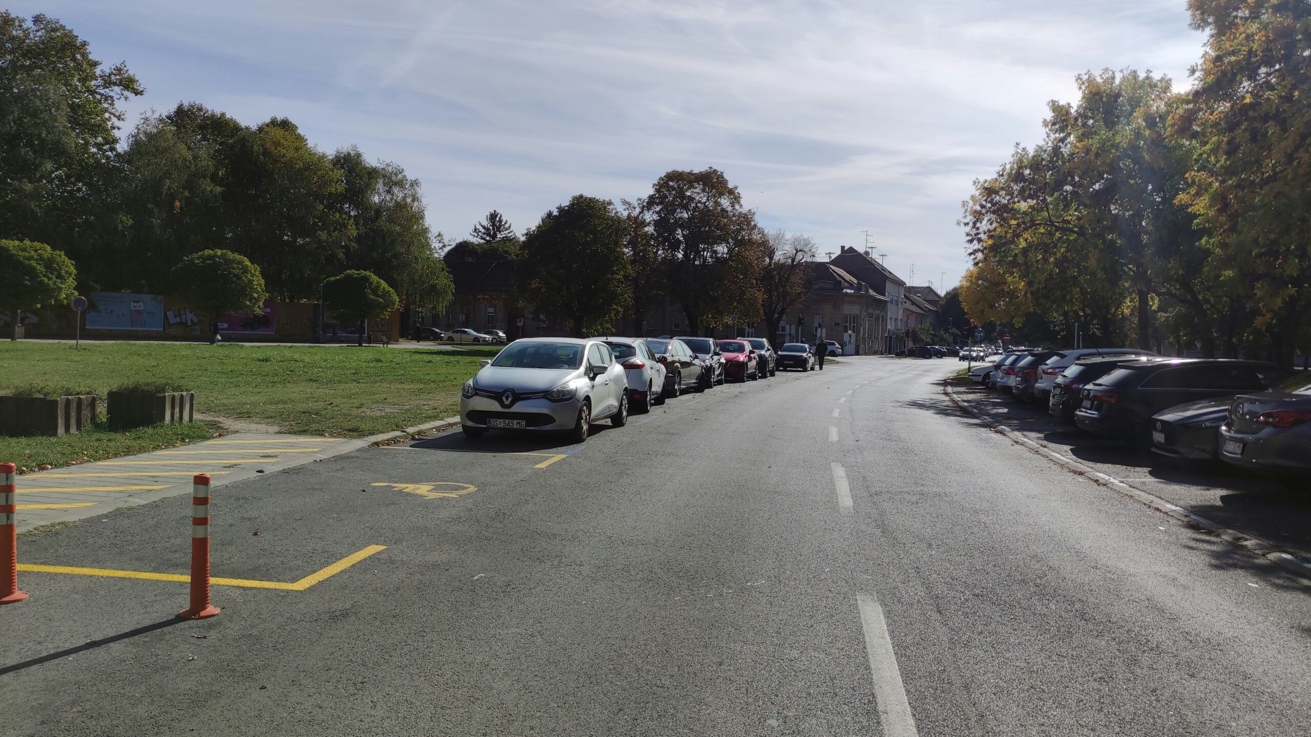 a row of parked cars in a parking lot